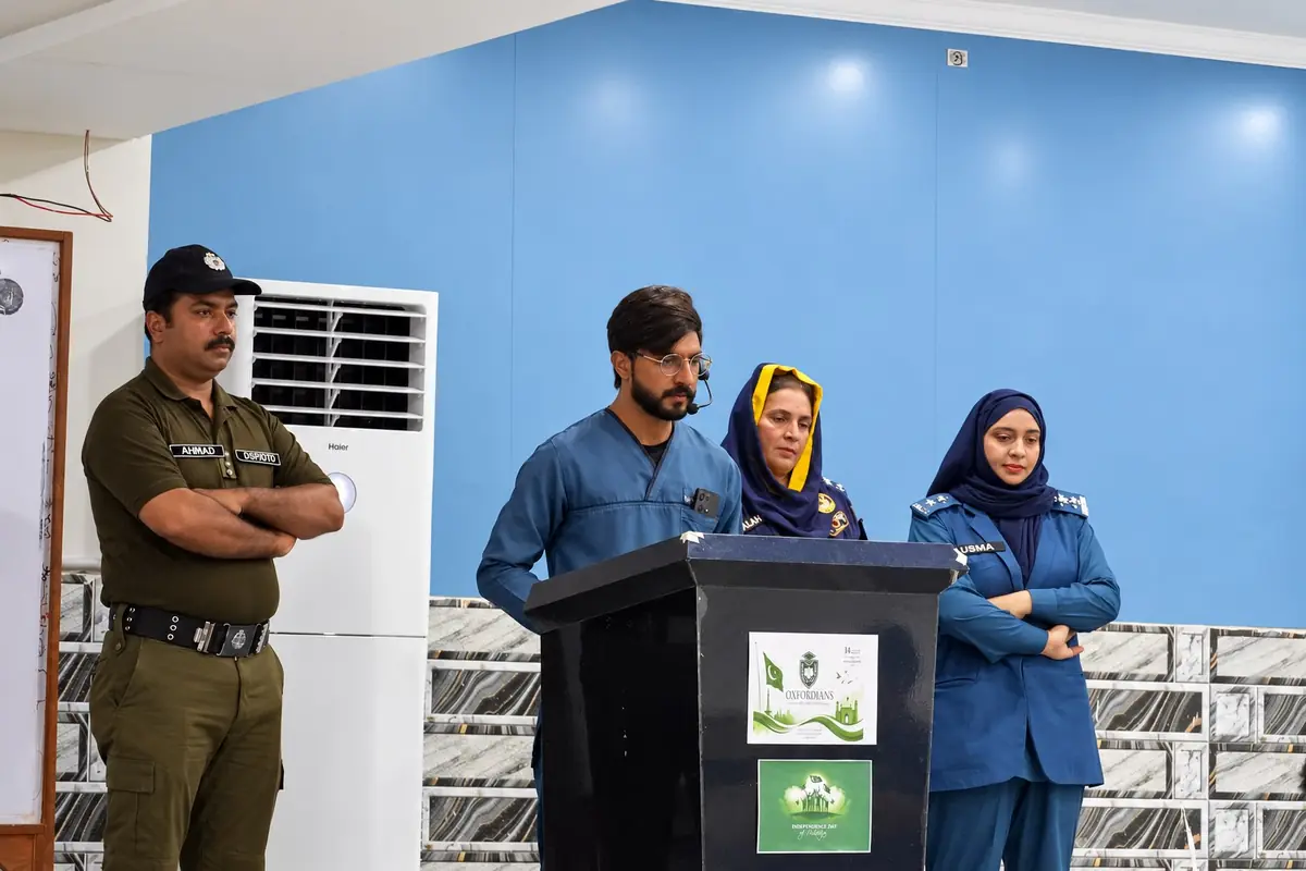 Uniformed officers and college participants at an awareness event